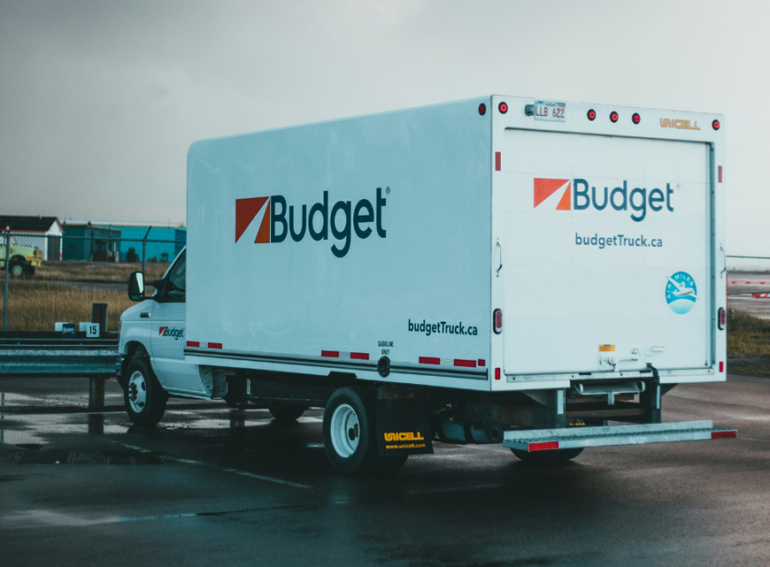 A Budget moving truck is parked in a parking spot