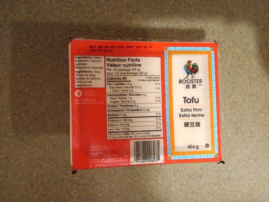 A package of Rooster Extra Firm tofu displaying the nutrition facts.