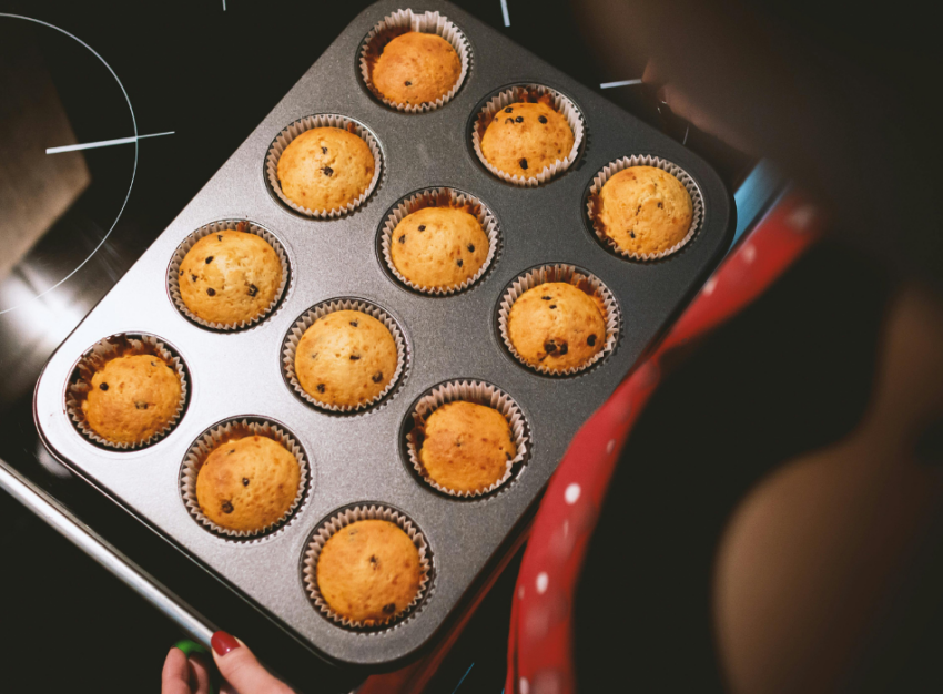 A tray of 12 chocolate chip muffins.