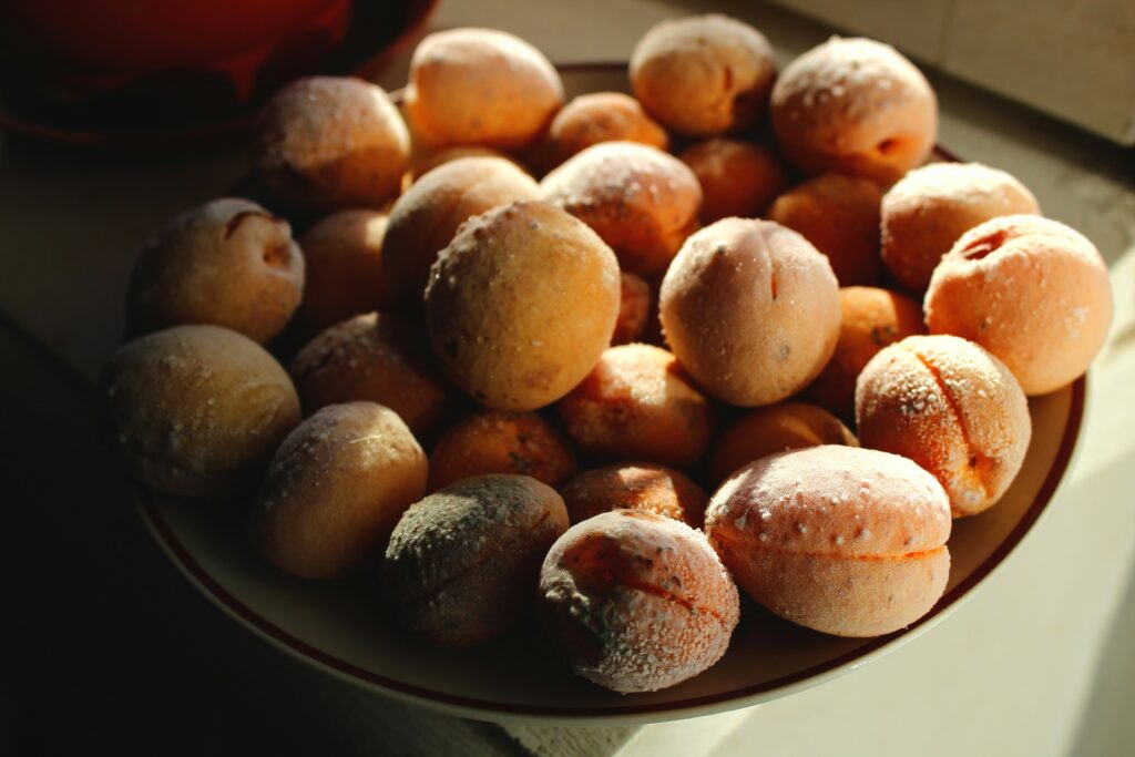 A bowl of frozen peaches.